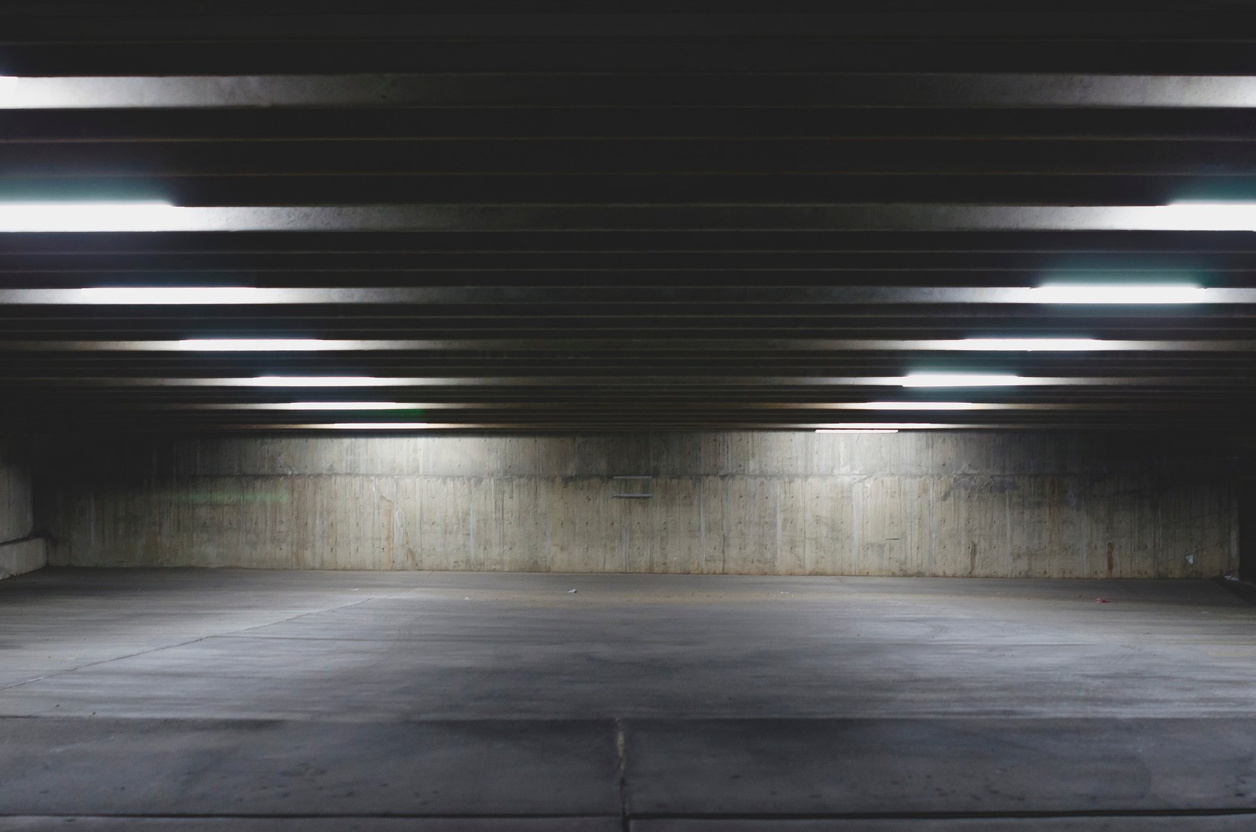 A big empty parking garage under the lights